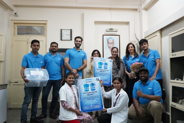 The FRST team and hospital staff gather with safety-gear materials during the Lotus Eye Hospital visit.