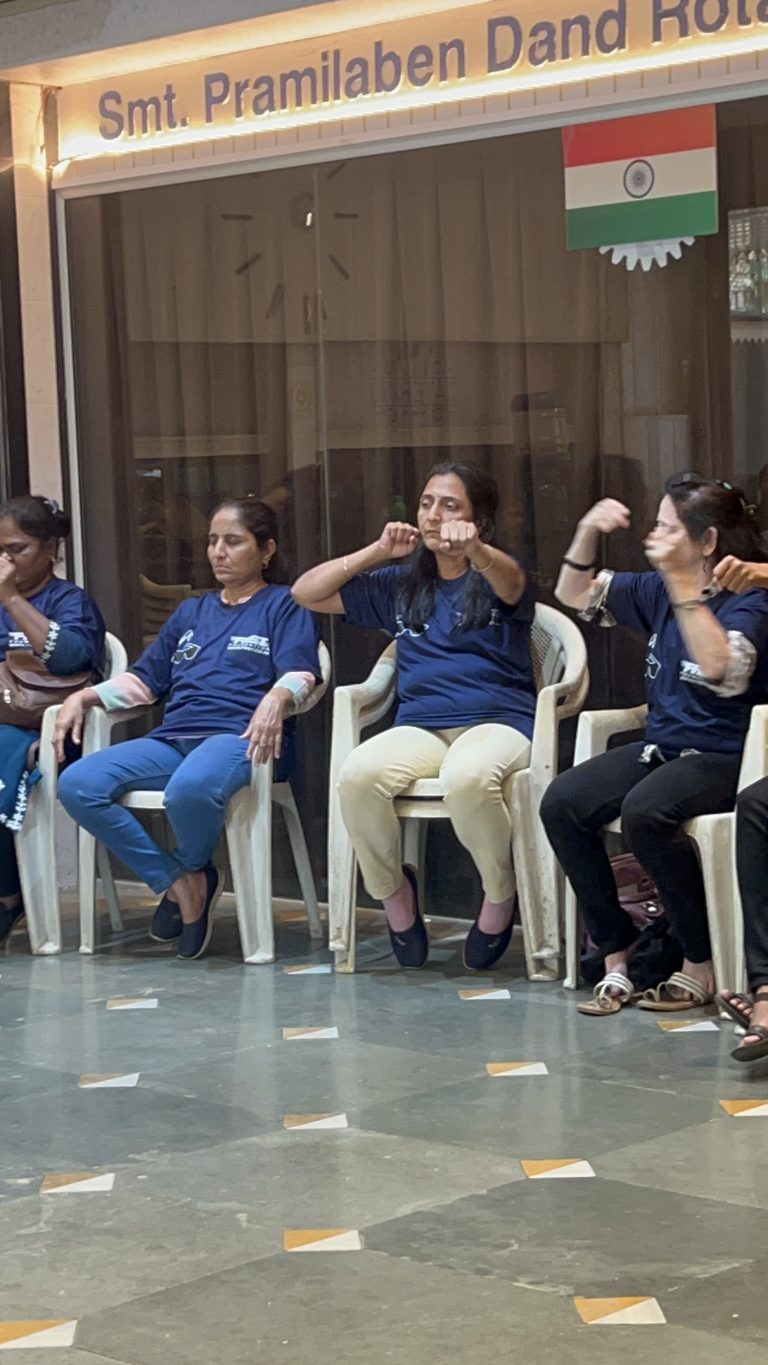 Participants practise hand movements while seated at BPA’s self-defence workshop.